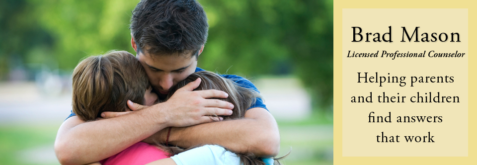 Dad Hugging Children